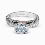 This exquisite white gold engagement ring is highlighted by .04 ctw of princess cut white diamonds and .34 ctw of round cut white diamonds.